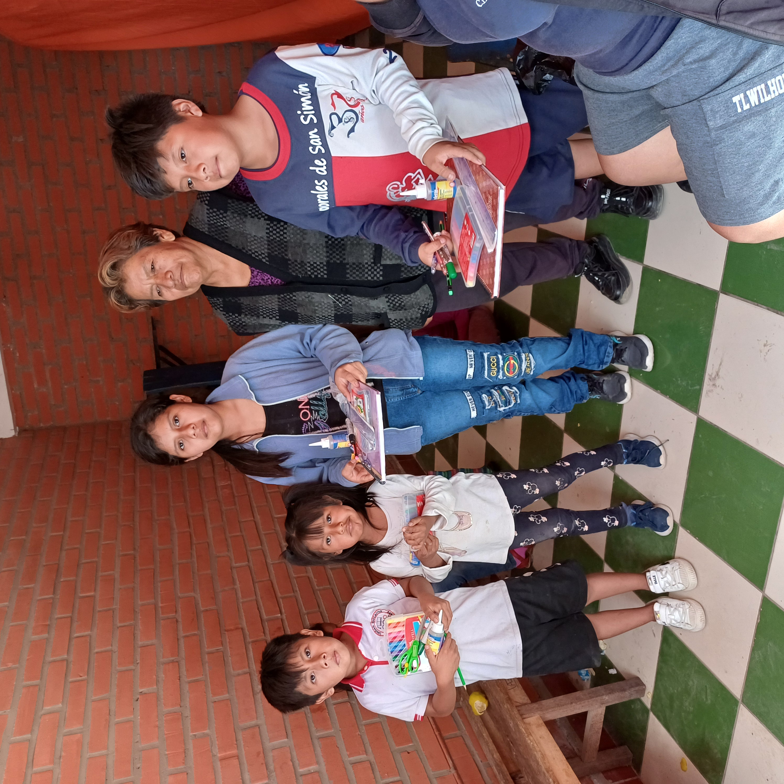 Children and a mother at the school support project